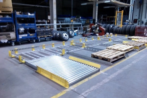 Pallet shifters and roller conveyor - buffer for wheel transport
